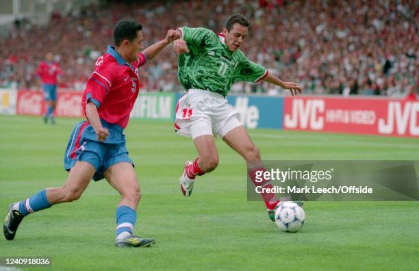 June 1998, Lyon - FIFA World Cup - Korea Republic v Mexico - Min Sung Lee of Korea and Cuauhtemoc Blanco of Mexico.