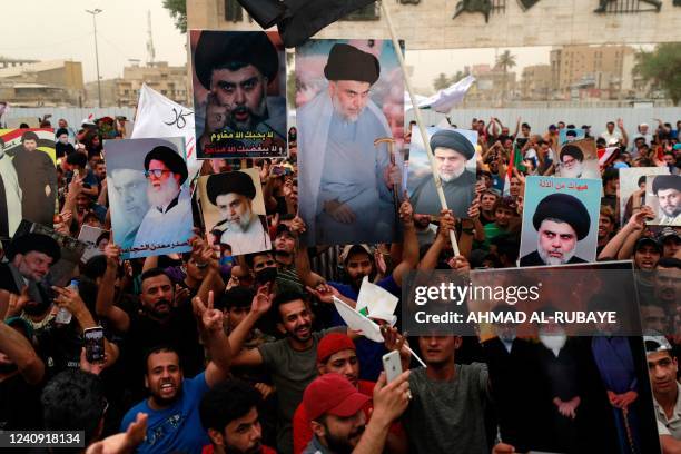 Supporters of Iraqi Shiite cleric Muqtada al-Sadr gather in Baghdad's Tahrir Square on May 26 to celebrate the passing of a bill that criminalizes...