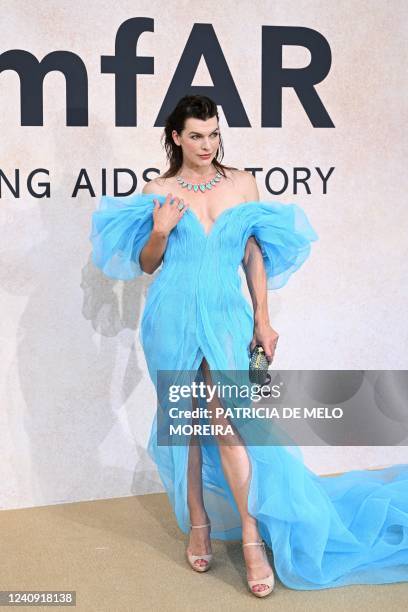 Ukrainian actress Milla Jovovich arrives on May 26, 2022 to attend the annual amfAR Cinema Against AIDS Cannes Gala at the Hotel du Cap-Eden-Roc in...