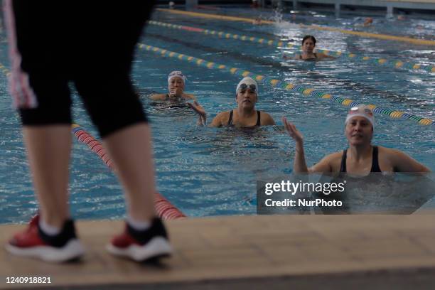 An instructor in front of a group of inhabitants of Milpa Alta in Mexico City, during an exhibition of Aqua Zumba or zumba in a pool on the occasion...