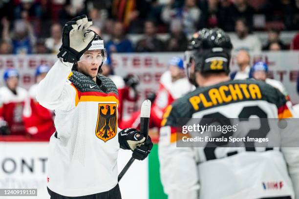 Moritz Seider of Germany celebrates his goal with Matthias Plachta of Germany during the 2022 IIHF Ice Hockey World Championship match between...