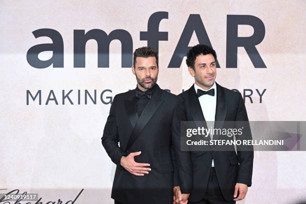 Puerto Rican singer actor Ricky Martin and Syrian-born Swedish painter Jwan Yosef arrive on May 26, 2022 to attend the annual amfAR Cinema Against...