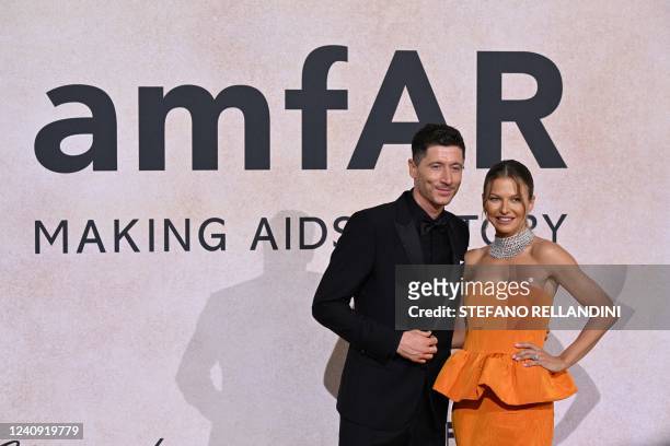 Polish striker Robert Lewandowski and his wife Anna Lewandowska arrive on May 26, 2022 to attend the annual amfAR Cinema Against AIDS Cannes Gala at...