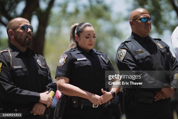 Uvalde police department officer reacts as Victor Escalon, Regional Director of the Texas Department of Public Safety South, speaks during a press...