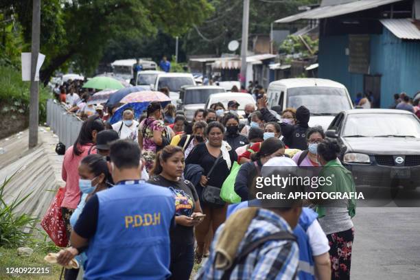 Salvadoran families await to receive information about their jailed relatives outside of the La Esperanza penitentiary center on May 26, 2022 in San...