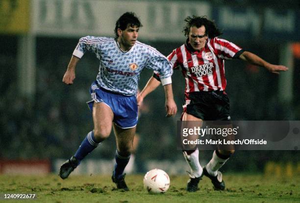 January 1992, Southampton - FA Cup 4th round - Southampton v Manchester United - Neil Webb of United and Terry Hurlock of Southampton on the bumpy...