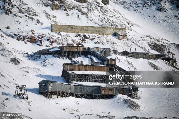 The defunct coal mine, Gruve 4, is pictured in Longyearbyen on May 2 on the Svalbard Archipelago, northern Norway. - Home to polar bears, the...