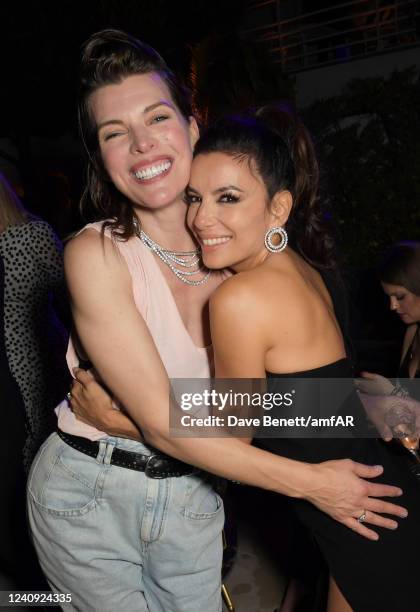 Milla Jovovich and Eva Longoria attend the amfAR Gala Cannes 2022 after party at the Hotel du Cap-Eden-Roc on May 26, 2022 in Cap d'Antibes, Côte...