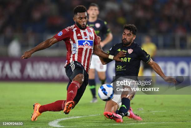 Colombia's Junior Miguel Borja and Argentina's Union Santa Fe Emanuel Britez vie for the ball during their Copa Sudamericana group stage football...