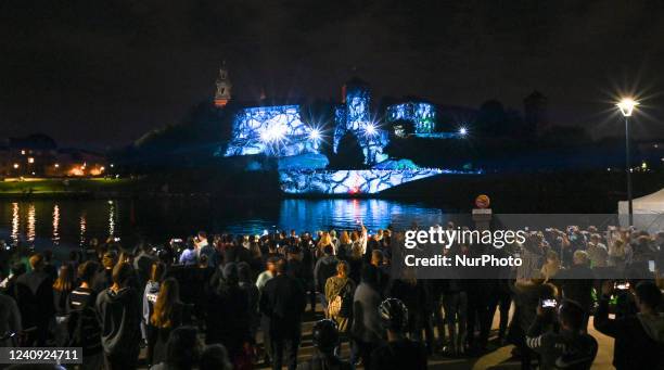 People watching the famous Wawel Castle illuminated during the Stranger Things 4 light show. Today, on the eve of the release of the fourth season of...