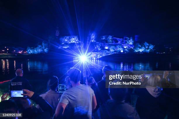 People watching the famous Wawel Castle illuminated during the Stranger Things 4 light show. Today, on the eve of the release of the fourth season of...