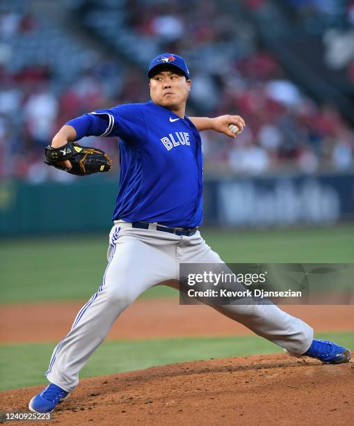 Starting pitcher Hyun Jin Ryu of the Toronto Blue Jays throws against the Los Angeles Angels during the second inning at Angel Stadium of Anaheim on...