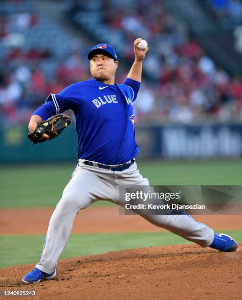 Starting pitcher Hyun Jin Ryu of the Toronto Blue Jays throws against the Los Angeles Angels during the second inning at Angel Stadium of Anaheim on...