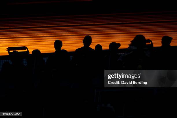 Fans stand during the seventh inning stretch during the game between the Kansas City Royals and Minnesota Twins at Target Field on May 26, 2022 in...