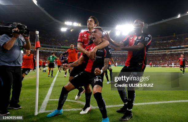 Luis Reyes of Atlas celebrates with teammates after scoring against Pachuca during their Mexican Clausura 2022 tournament first leg final football...