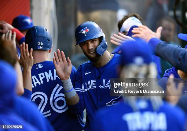 Lourdes Gurriel Jr. #13 of the Toronto Blue Jays celebrates after scoring a run during the third inning against starting pitcher Shohei Ohtani of the...