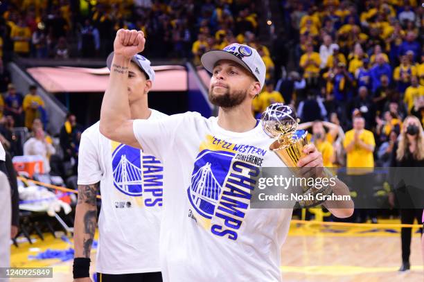 Stephen Curry of the Golden State Warriors celebrates after winning the Magic Johnson Western Conference Finals MVP award after Game 5 of the 2022...