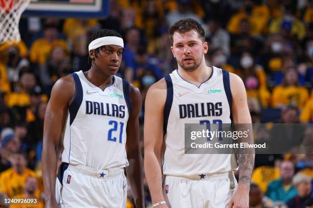 Frank Ntilikina and Luka Doncic of the Dallas Mavericks looks on during Game 5 of the 2022 NBA Playoffs Western Conference Finals on May 26, 2022 at...