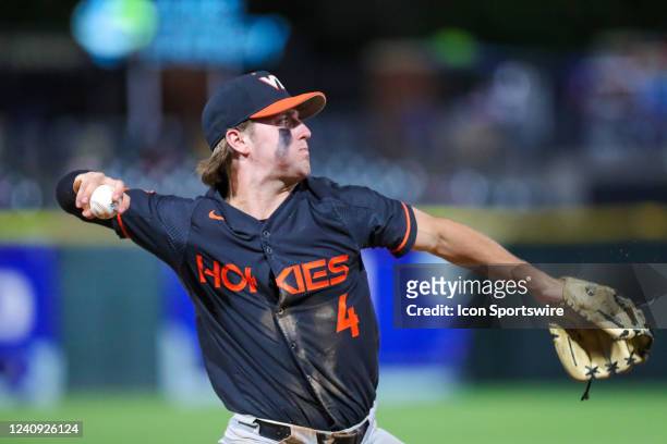 Carson DeMartini of the Virginia Tech Hokies throws the ball to first base after a diving catch during the ACC Baseball Championship Tournament...