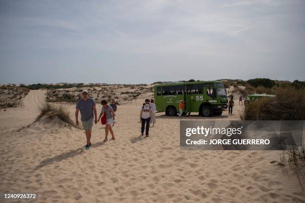 Tourists visit the Donana Natural Park in Ayamonte, Huelva, on May 19, 2022. - The huge Donana National Park, home to one of Europe's largest...