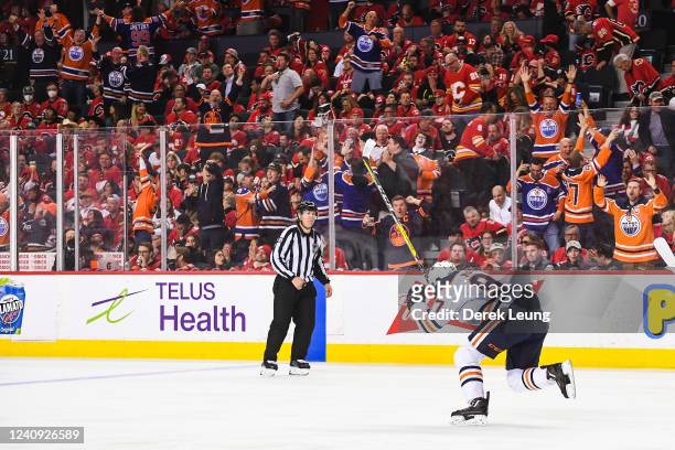 Connor McDavid of the Edmonton Oilers celebrates after scoring the game-winning goal against the Calgary Flames during the overtime period of Game...
