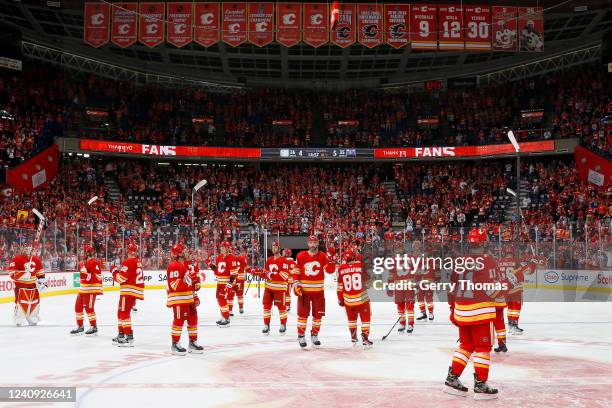 Teammates of the Calgary Flames acknowledge the crowd after the game against the Edmonton Oilers in Game Five of the Second Round of the 2022 Stanley...