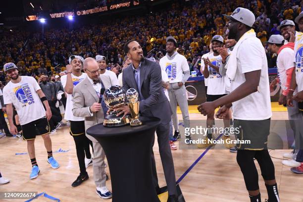 Former Golden State Warriors player, Shaun Livingston presents the Oscar Robertson Western Conference Championship Trophy to the Golden State...