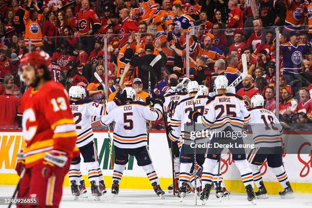The Edmonton Oilers celebrate after defeating the Calgary Flames during the overtime period of Game Five of the Second Round of the 2022 Stanley Cup...
