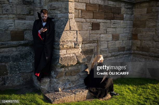 Vampires gather in the grounds of Whitby Abbey during a Guinness world record attempt to gather the largest number of vampires together in one place,...