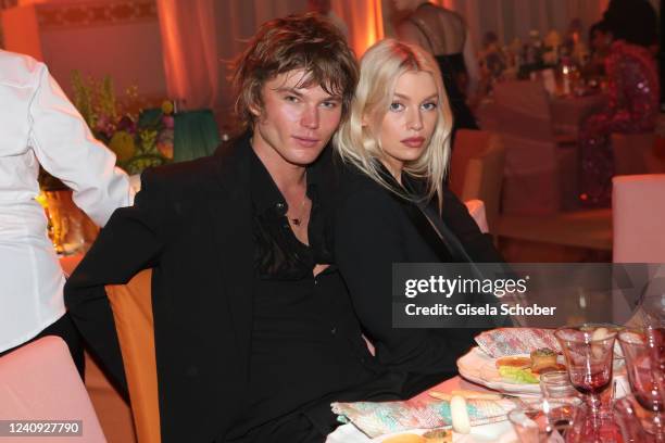 Jordan Barrett and Stella Maxwell attend the amfAR Cannes Gala 2022 at Hotel du Cap-Eden-Roc on May 26, 2022 in Cap d'Antibes, France.