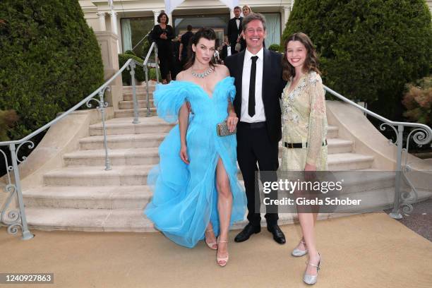 Ever Gabo Anderson, Milla Jovovich and Paul W. S. Anderson attend the amfAR Cannes Gala 2022 at Hotel du Cap-Eden-Roc on May 26, 2022 in Cap...