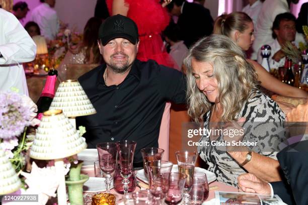 Leonardo DiCaprio and his mother Irmelin Indenbirken during the amfAR Cannes Gala 2022 at Hotel du Cap-Eden-Roc on May 26, 2022 in Cap d'Antibes,...