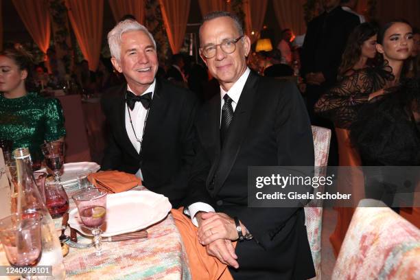 Baz Luhrmann and Tom Hanks attend the amfAR Cannes Gala 2022 at Hotel du Cap-Eden-Roc on May 26, 2022 in Cap d'Antibes, France.