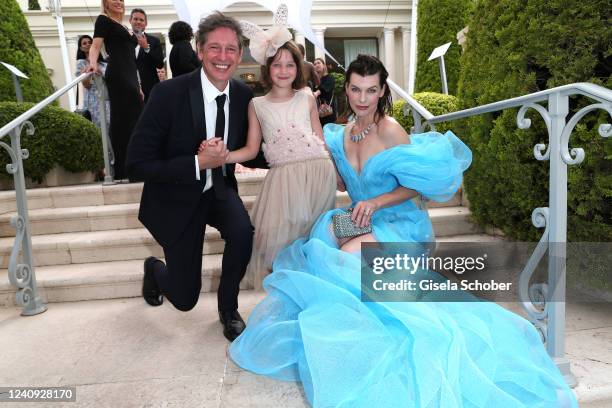 Paul W. S. Anderson, Dashiel Anderson and Milla Jovovich attend the amfAR Cannes Gala 2022 at Hotel du Cap-Eden-Roc on May 26, 2022 in Cap d'Antibes,...