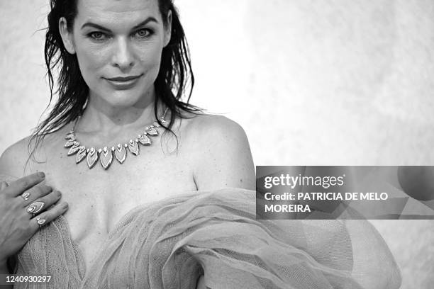 Ukrainian actress Milla Jovovich arrives on May 26, 2022 to attend the annual amfAR Cinema Against AIDS Cannes Gala at the Hotel du Cap-Eden-Roc in...