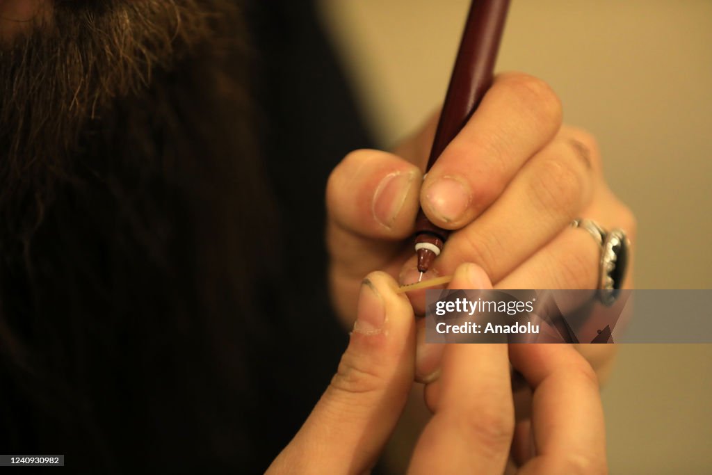 Iraq Calligraphy 25-year-old Iraqi calligraphy artist Qasim Mohammed Reza is seen ...