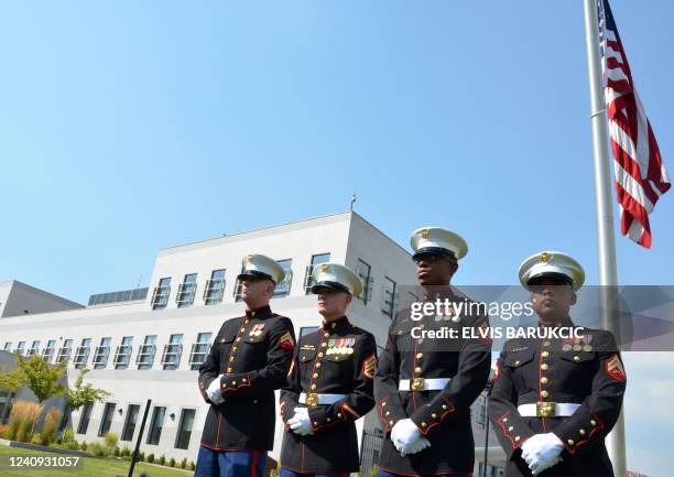 Marines stand in front of the flag of the United States of America, in front of the US embassy in Sarajevo, on September 9, 2011. In memory of those...