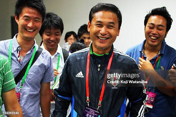 Japan head coach Norio Sasaki attends the press interview after securing the olympic berth at Jinan Olympic Sports Centre on September 8, 2011 in...