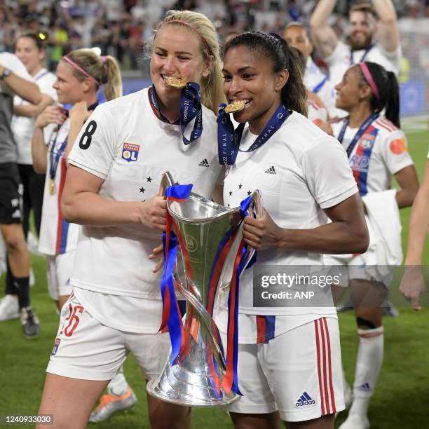 Lindsey Horan of Olympique Lyonnais women, Catarina Macario of Olympique Lyonnais women with the UEFA women champions league trophy during the UEFA...