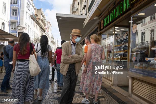 Person wearing a protective mask is seen walking in Augusta street, in downtown. Lisbon, May 23, 2022. The European Centre for Disease Prevention and...