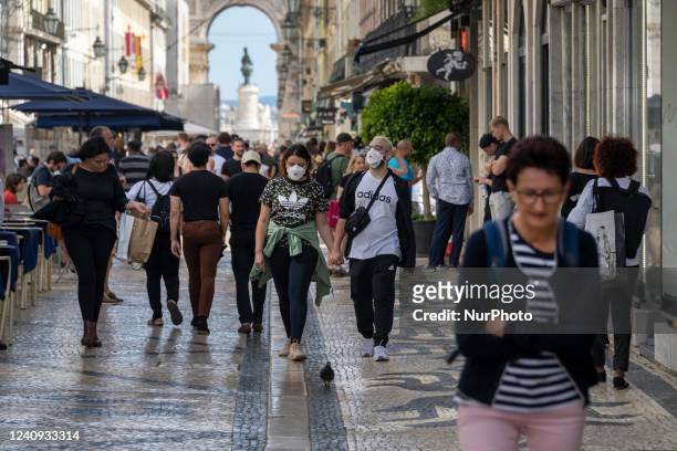 People wearing protective masks are seen walking in Augusta street, in the downtown area. Lisbon, May 23, 2022. The European Centre for Disease...