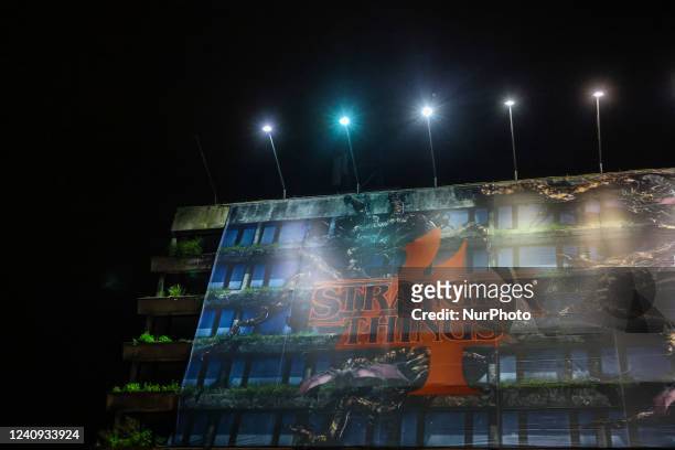 Huge banner advertising the premiere of the fourth season of 'Stranger Things' series on Netflix is seen on the former Forum Hotel building in...
