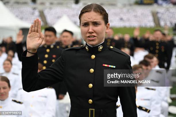Marine Corps graduate takes her oath during the US Naval Academy 2022 Graduation Ceremony at the Navy-Marine Corps Memorial Stadium in Annapolis,...