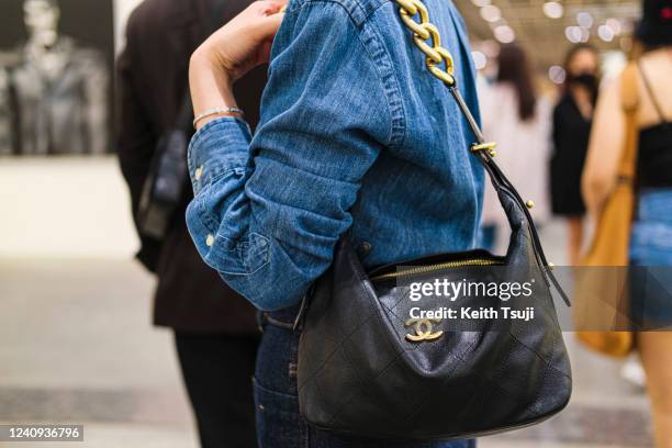 Paris, France - March 5, 2019: Street Style - Woman Wearing Wearing A White  Shirt, Light Blue Pants, Black Heels, Light Blue Hat And Printed Chanel  Bag, Before A Fashion Show During