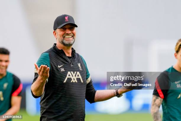 Head coach Juergen Klopp of Liverpool FC laughs during the UEFA Champions League Final 2021/22 Liverpool FC Training Session at Stade de France on...