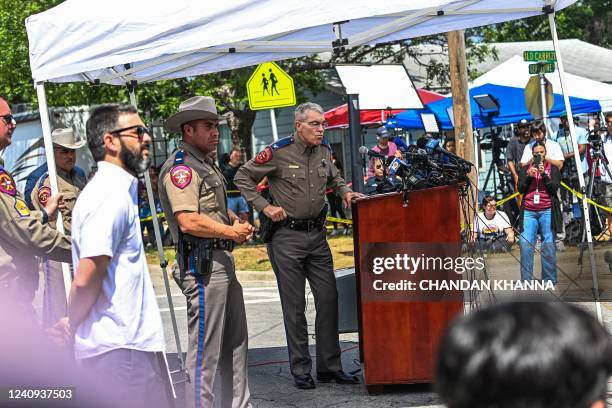 Director and Colonel of the Texas Department of Public Safety Steven C. McCraw listens during a press conference outside Robb Elementary School in...