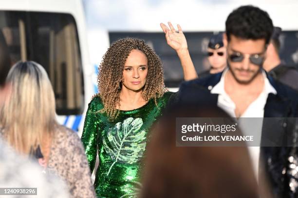 Angolan businesswoman Isabel Dos Santos waves as she leaves the screening of the film "Mother And Son " during the 75th edition of the Cannes Film...