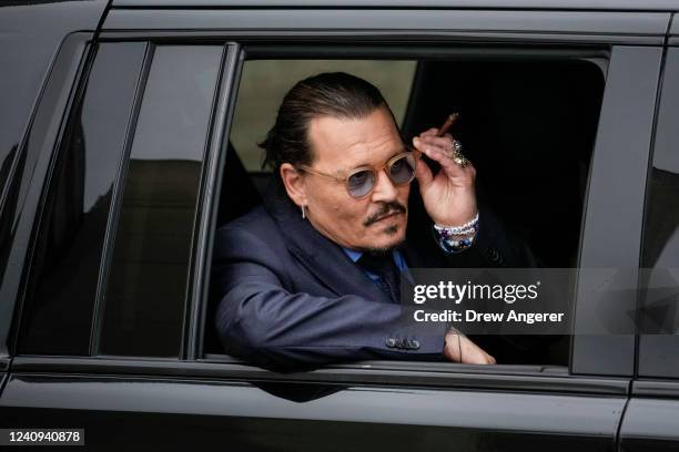 Actor Johnny Depp sits in his vehicle as he departs the Fairfax County Courthouse on May 27, 2022 in Fairfax, Virginia. Closing arguments in the Depp...