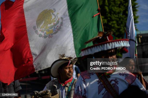 Members of the Wixarika indigenous community march towards the Palacio Nacional from the Basilica of Guadalupe, to demand that the government of...