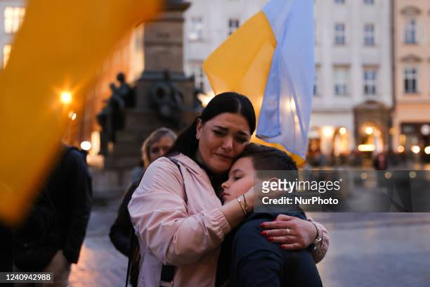 People attend a charity concert 'Thank You Is Not Enough' organized by Ukrainians at the Main Square in Krakow Poland, on May 27, 2022. The event was...